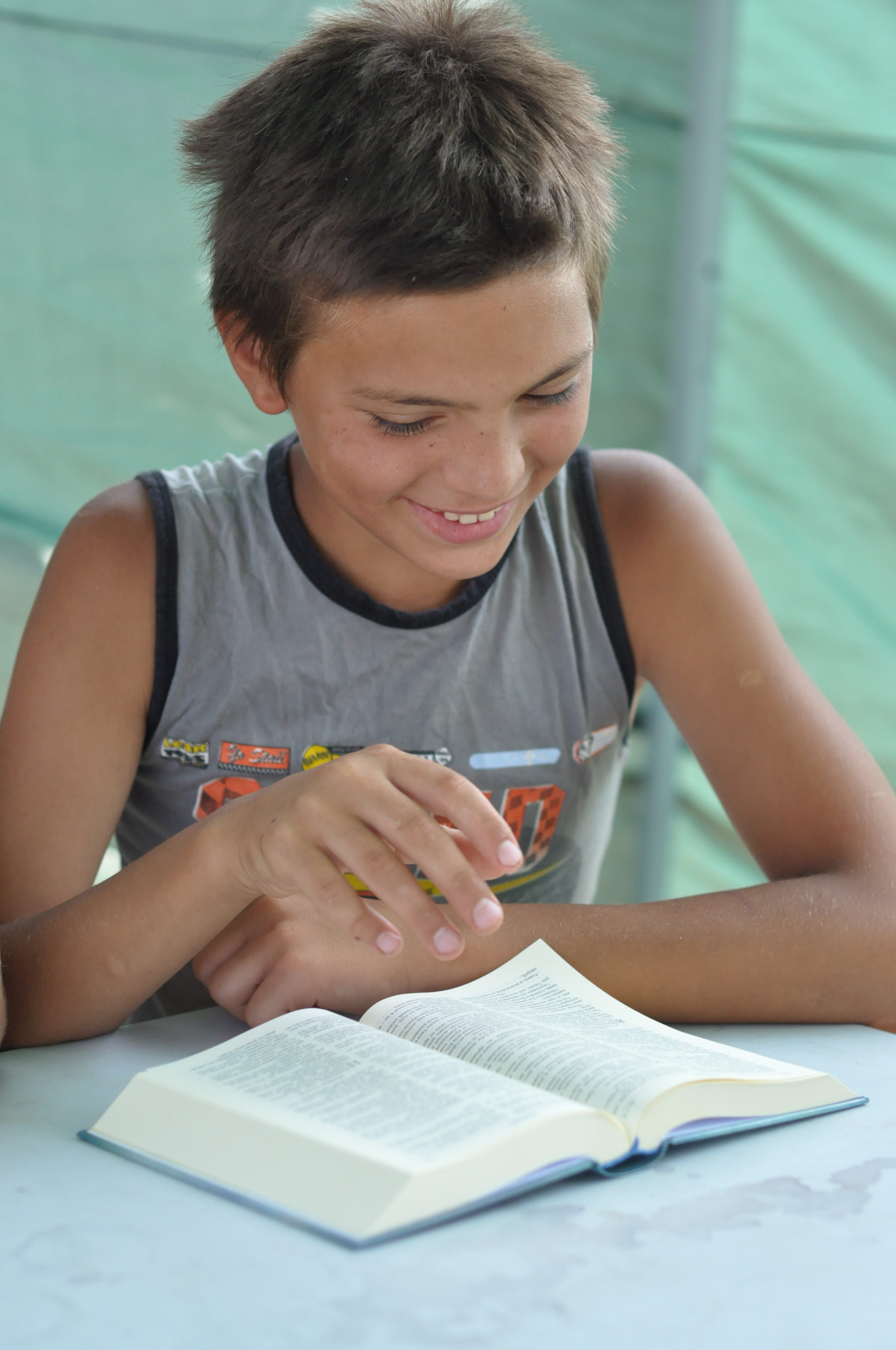 Young boy reading the Bible