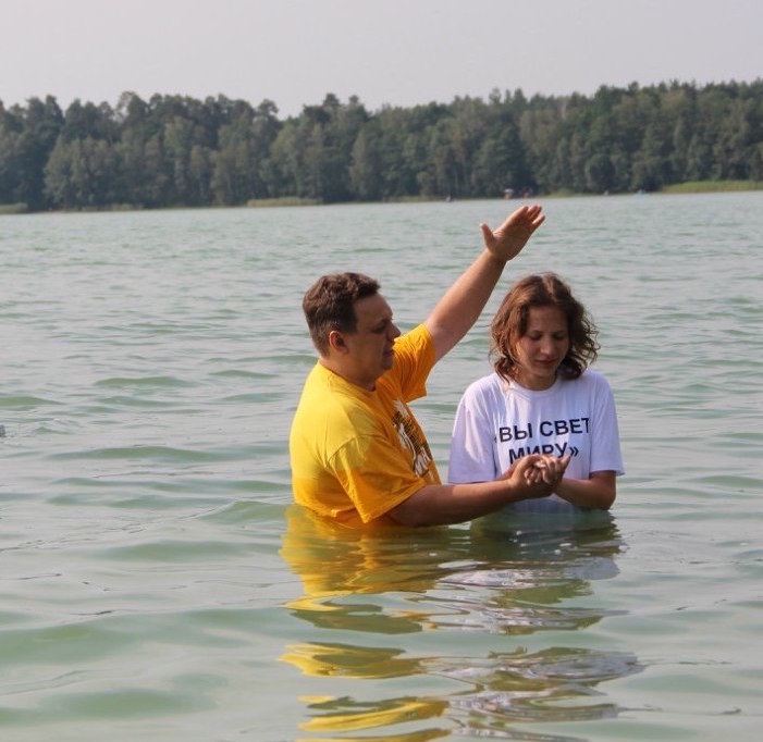 Young woman being baptized in Belarus