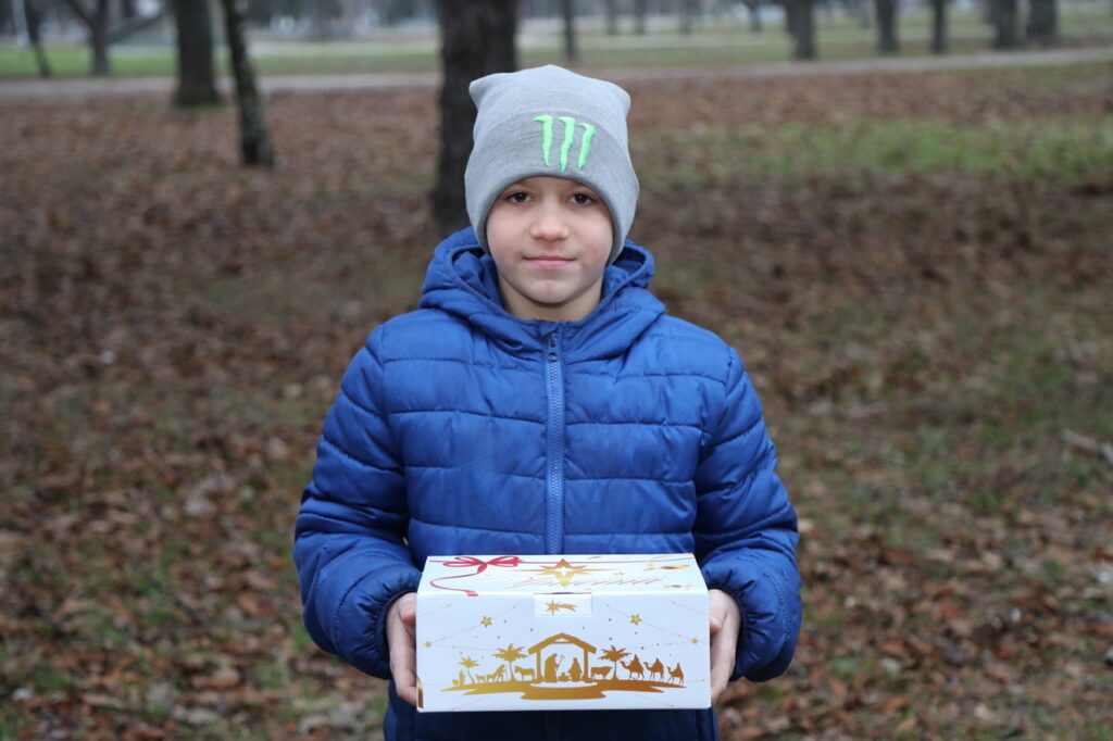 child holding a gift of hope in Ukraine