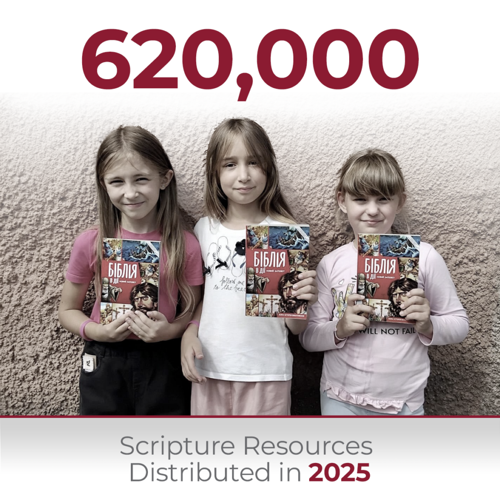 Infographic showing 620,000 Scripture resources distributed in 2025, featuring three smiling young girls holding copies of the Bible.