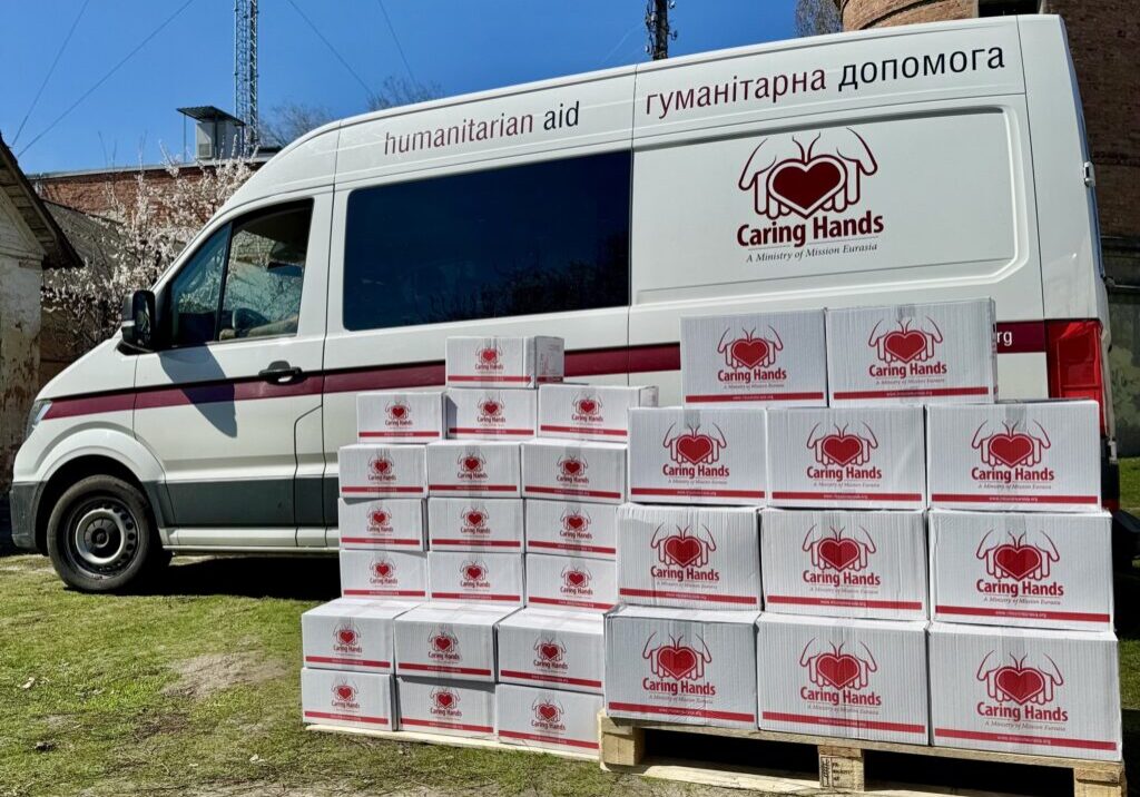 Truck with Caring Hands boxes full of humanitarian aid supplies