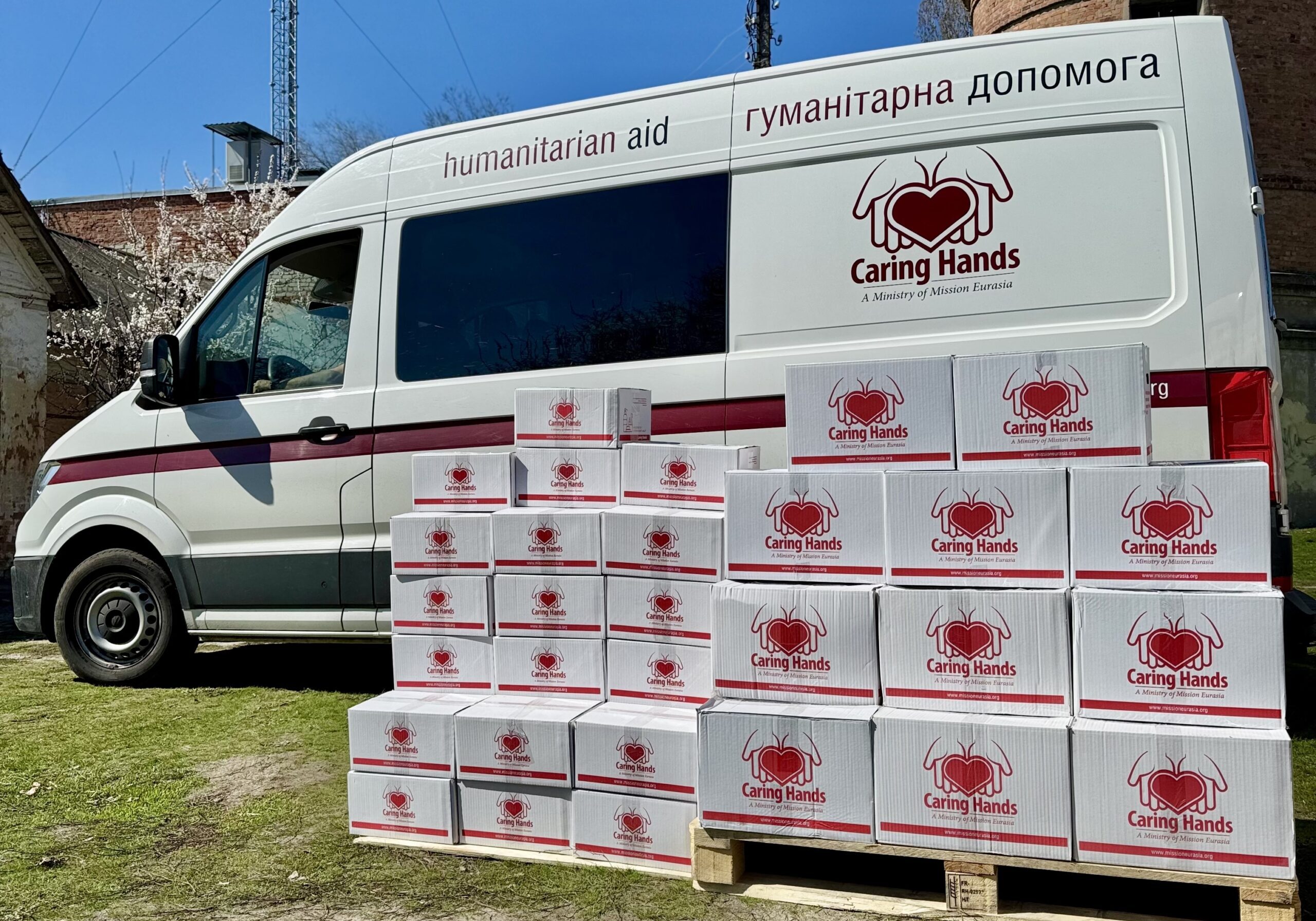 Truck with Caring Hands boxes full of humanitarian aid supplies